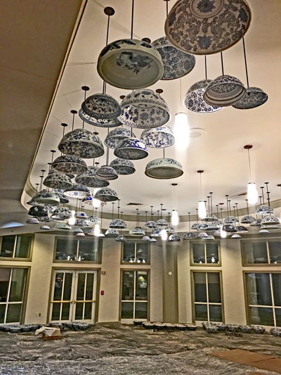 Upside down bowls hanging from restaurant's ceiling