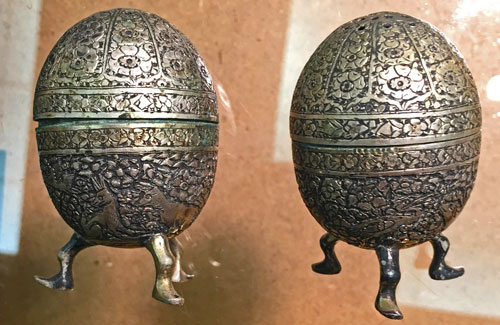 Vintage silver salt and pepper shakers with intricate design